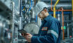 Technician performing calibration on a temperature sensor with digital certificate displayed on a tablet screen